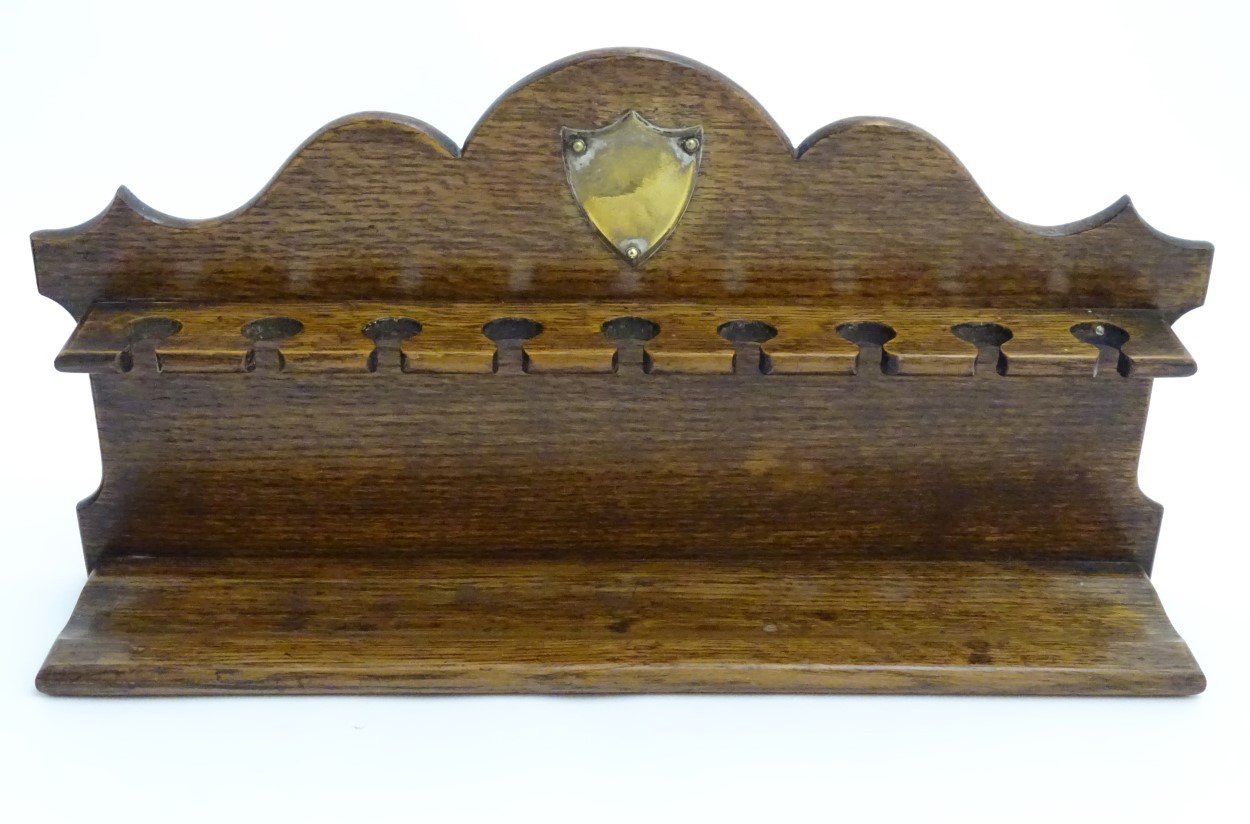 Pipe smoking: An early 20thC oak pipe rack, with provision for nine pipes, - Image 9 of 12