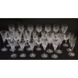 Wine glasses: A large quantity of conical cut crystal glasses of various sizes,