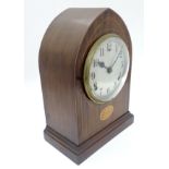 Wm Gilbert Clocks: a Lancet shaped inlaid mahogany 8 day clock striking on a coiled gong with 5