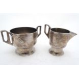 Decorative Metalware : a WMF harvest Pattern Strawberry set ( cream jug and sugar bowl ) having