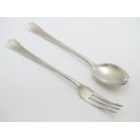 A silver pickle fork together with a small serving spoon / runcible spoon hallmarked Sheffield
