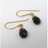 A pair of gilt metal drop earrings set with facet cut drops.