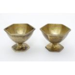 A pair of silver gilt salts of hexagonal form.