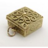 A 9ct gold pendant charm formed as a miniature box with hinged lid approx.