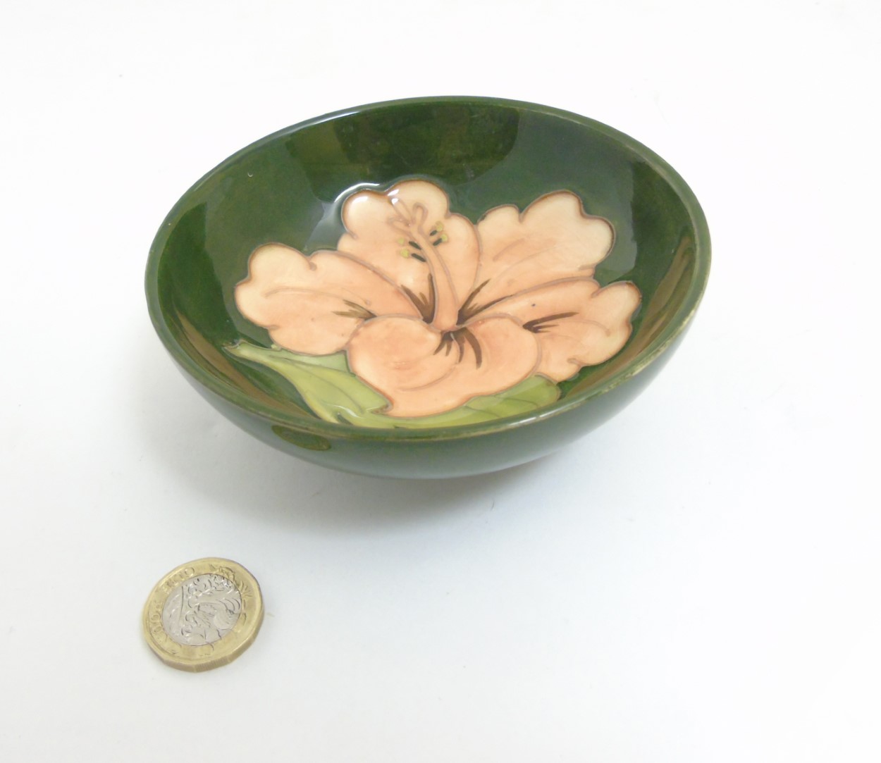 A Moorcroft Hibiscus pottery bowl dish, with pink hibiscus design on green ground, - Image 3 of 6