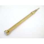 S. Mordan & Co: A gilt metal propelling pencil with intaglio cross seal c.