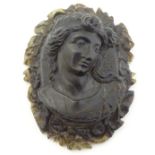 A Victorian carved horn vignette depicting a classical maiden within a floral surround 2 1/4" high