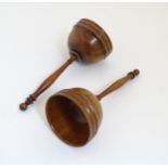 A pair of 19thC walnut cups from a ball and cup game.
