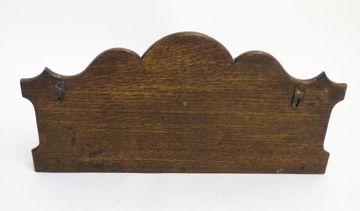Pipe smoking: An early 20thC oak pipe rack, with provision for nine pipes, - Image 11 of 12