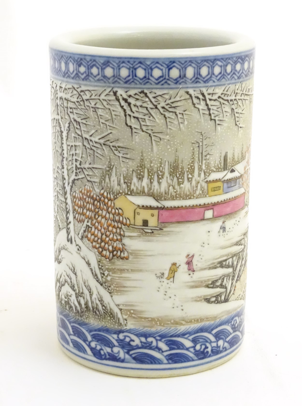 A Chinese famille rose brush pot depicting a winter/snowy landscape,