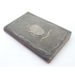 A notebook having silver front cover. Hallmarked Chester early 20thC maker Arthur Johnson Smith.
