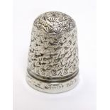 A white metal thimble with reg des. no for c.