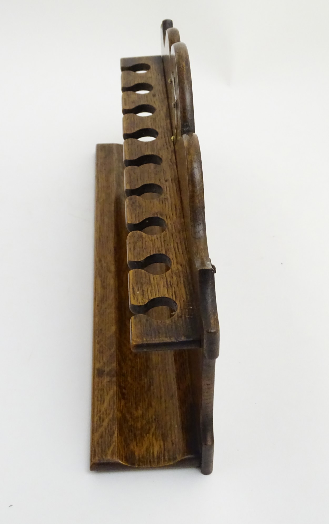 Pipe smoking: An early 20thC oak pipe rack, with provision for nine pipes, - Image 12 of 12