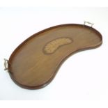An Edwardian inlaid mahogany Sheraton Revival kidney shaped butlers tray with shell inlay.