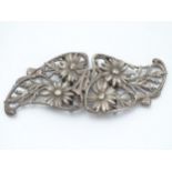 A hallmarked silver 2-part belt buckle with Michaelmas daisy decoration 5 1/4" wide.