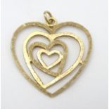A 9ct gold pendant formed as concentric hearts 1 1/4" long (2.