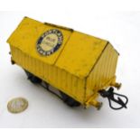 A Hornby O gauge 'Portland Cement Blue Circle' cement wagon in yellow, 4 3/4" wide,