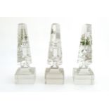Glass prisms / obelisks : Three Victorian glass triangular prisms on square bases with hand