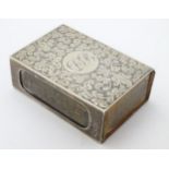A silver match box cover having engraved acanthus scroll decoration.