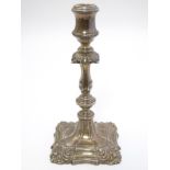 A silver candlestick hallmarked Birmingham 1975 maker Barker Brothers Silver Ltd. 8 3/4" high.