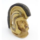 A stoneware studio pottery model of a centurion's head. Approx. 9” high.