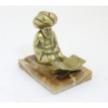 A French Colonial brass Standish with Turkish Ottoman figure mounted on an onyx like stand,