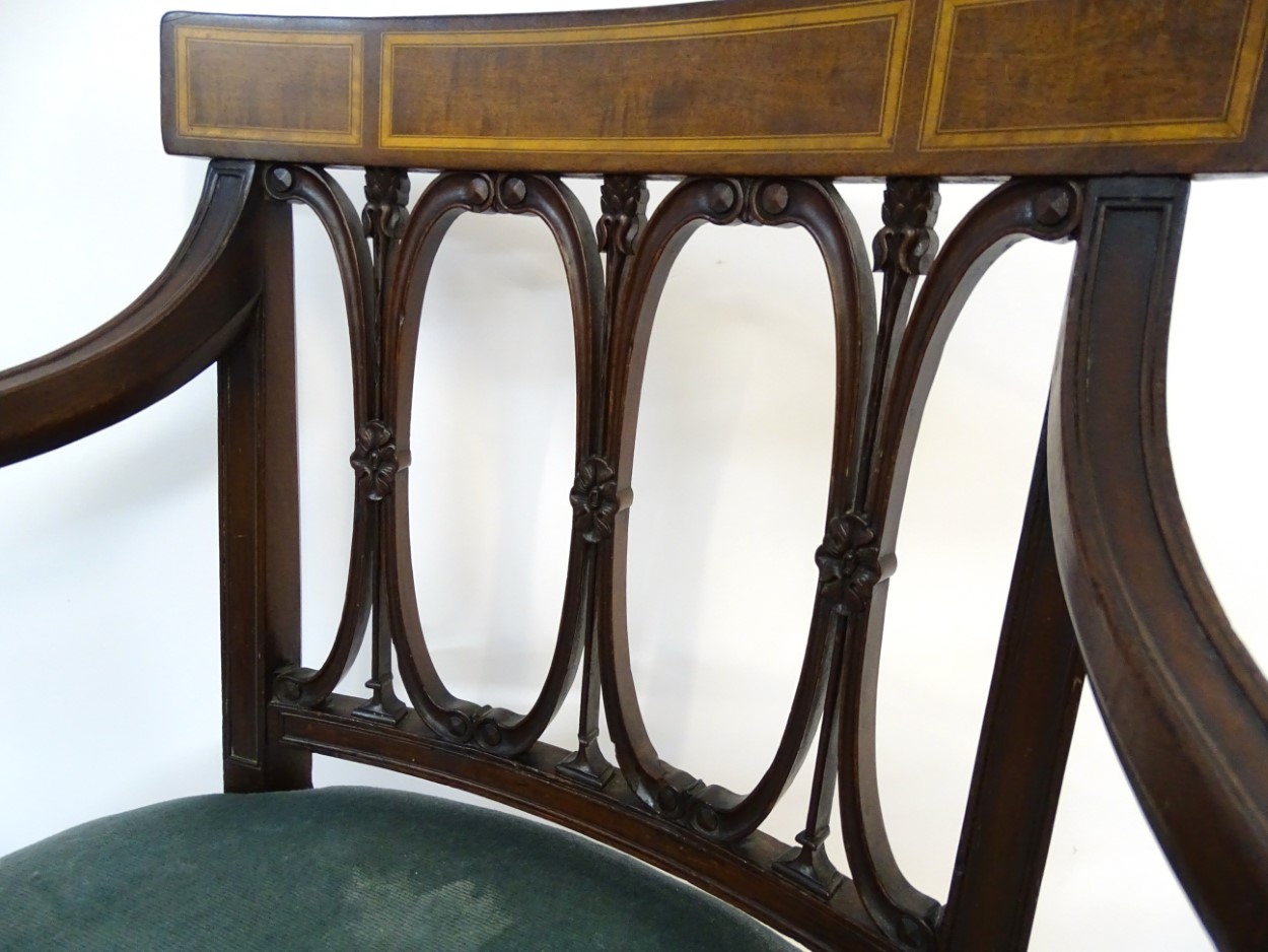 An Edwardian mahogany open armchair with satinwood inlaid top rail, repeating carved oval backrest, - Image 4 of 7
