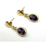 A pair of 9ct gold drop earrings set with amethysts ¾" long CONDITION: Please Note -