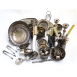 Assorted silver plated wares to include various flatware, telescopic candlestick, sugar scuttles,