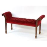 An early 20thC window seat with deep buttoned upholstery,
