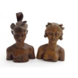 A pair of carved hardwood Polynesia bust figures, male and female.