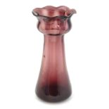 Hyacinth vase: an unusual purple glass, petal topped circa 1900 Hyacinth vase, standing 7 3/4" high.