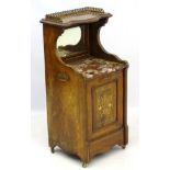 A Victorian rosewood purdonium with brass gallery above serpentine shaped top tier,