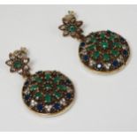 A pair of silver drop earrings with gilt metal decoration and set with green, white and blue stones.