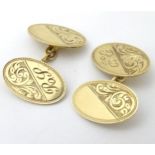 A pair of 9ct gold cufflinks with engraved acanthus scroll decoration etc.