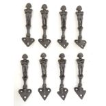 Militaria : A set of eight c1900 black - painted cast iron Coat Hooks ,