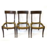 A set of three Regency mahogany chairs with Klismos style legs,