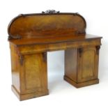 A Victorian mahogany sideboard with carved floral backstand,