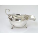 A silver sauce boat hallmarked London 1904 and stamped ' Mappin Brothers 220 Regent St. W.