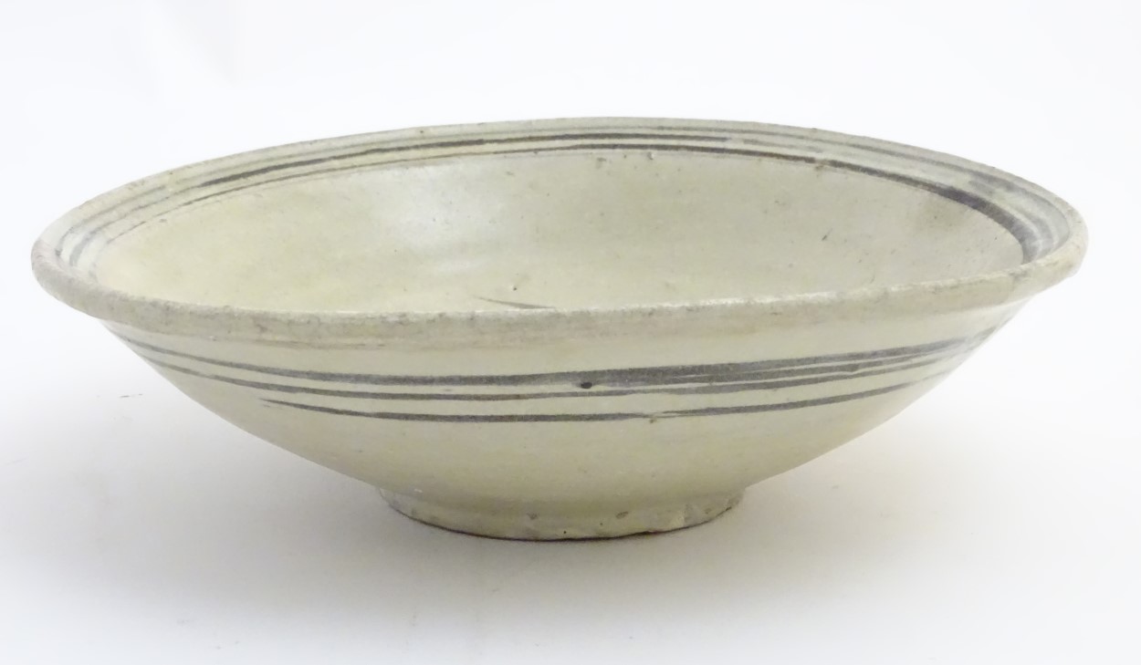 A Chinese Ming Dynasty celadon glazed bowl with hand painted fish decoration to the centre and - Image 4 of 5