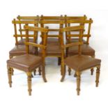 A set of eight mid / late 19thC oak Pugin inspired dining chairs with curved top and mid rail with