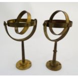 2 brass pedestal gimbal mounts.