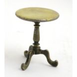 A late 19thC / early 20thC cast brass miniature tripod table.