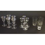 A quantity of assorted clear wine glasses and tumblers with wheel cut decoration.