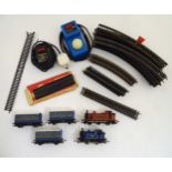 A quantity of 00 gauge model railway equipment, comprising Hornby engine and three carriages,