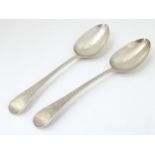 Two Geo III silver table spoons having bright cut decoration.