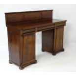 A mid 19thC mahogany pedestal sideboard with moulded upstand,