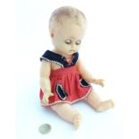 A 20thC Rosebud doll with articulated head and limbs. Approx.