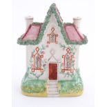 A Staffordshire pottery model of a flat back house. Approx. 8 ½" high x 6" wide.