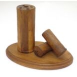 Shooting: a desk tidy, of figured walnut construction, formed as three shotgun cartridges.